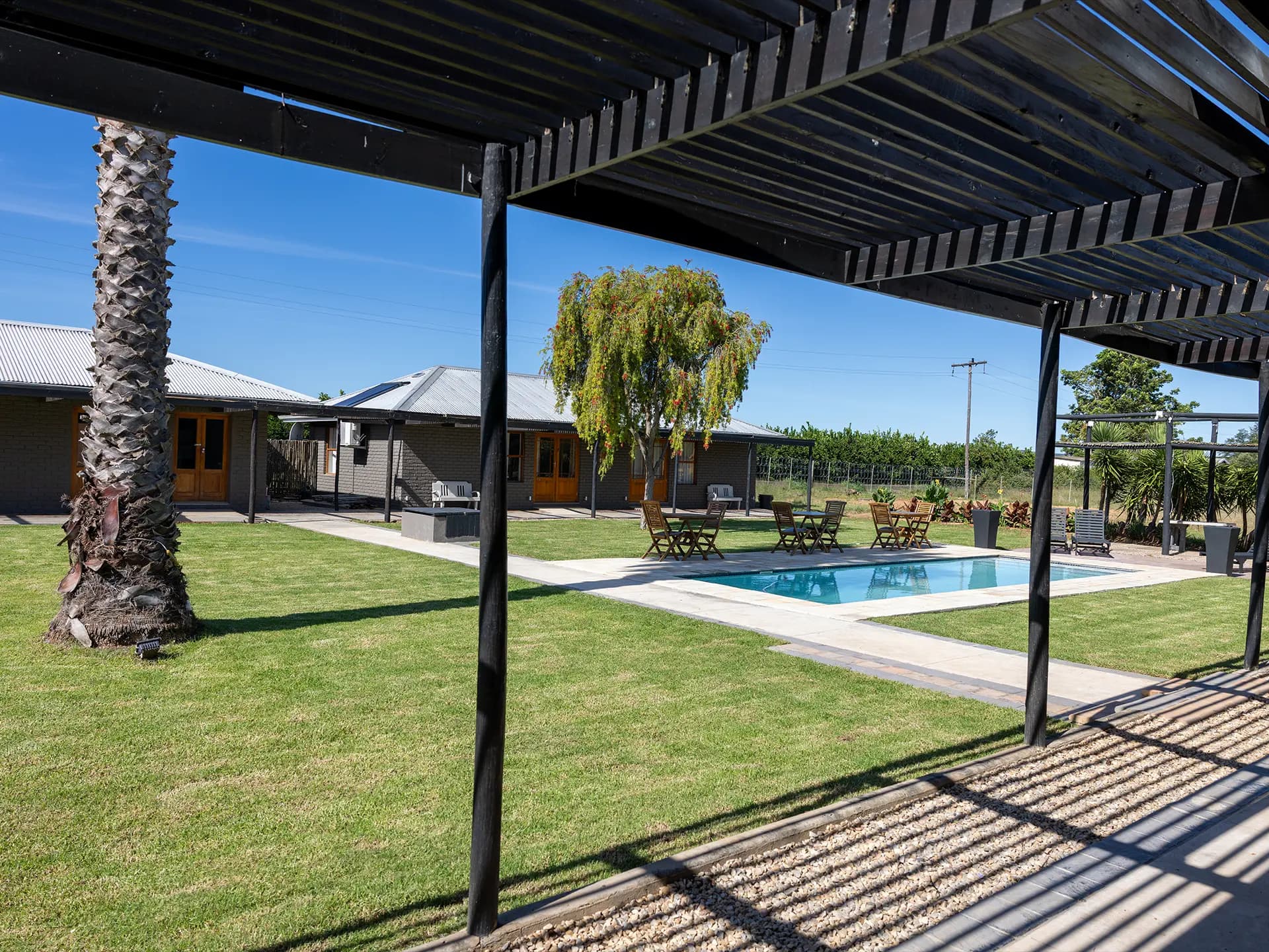 Garden and pool view with mountain backdrop