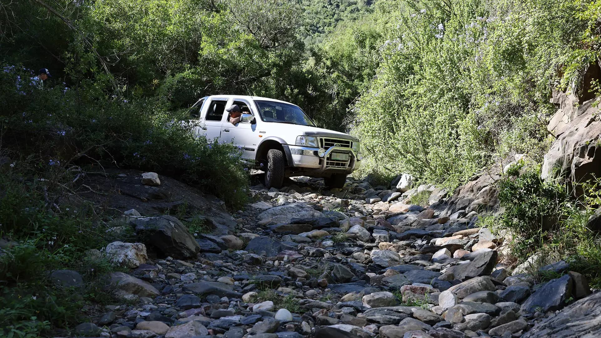 4x4 crossing a rocky riverbed on the Kabouga trail